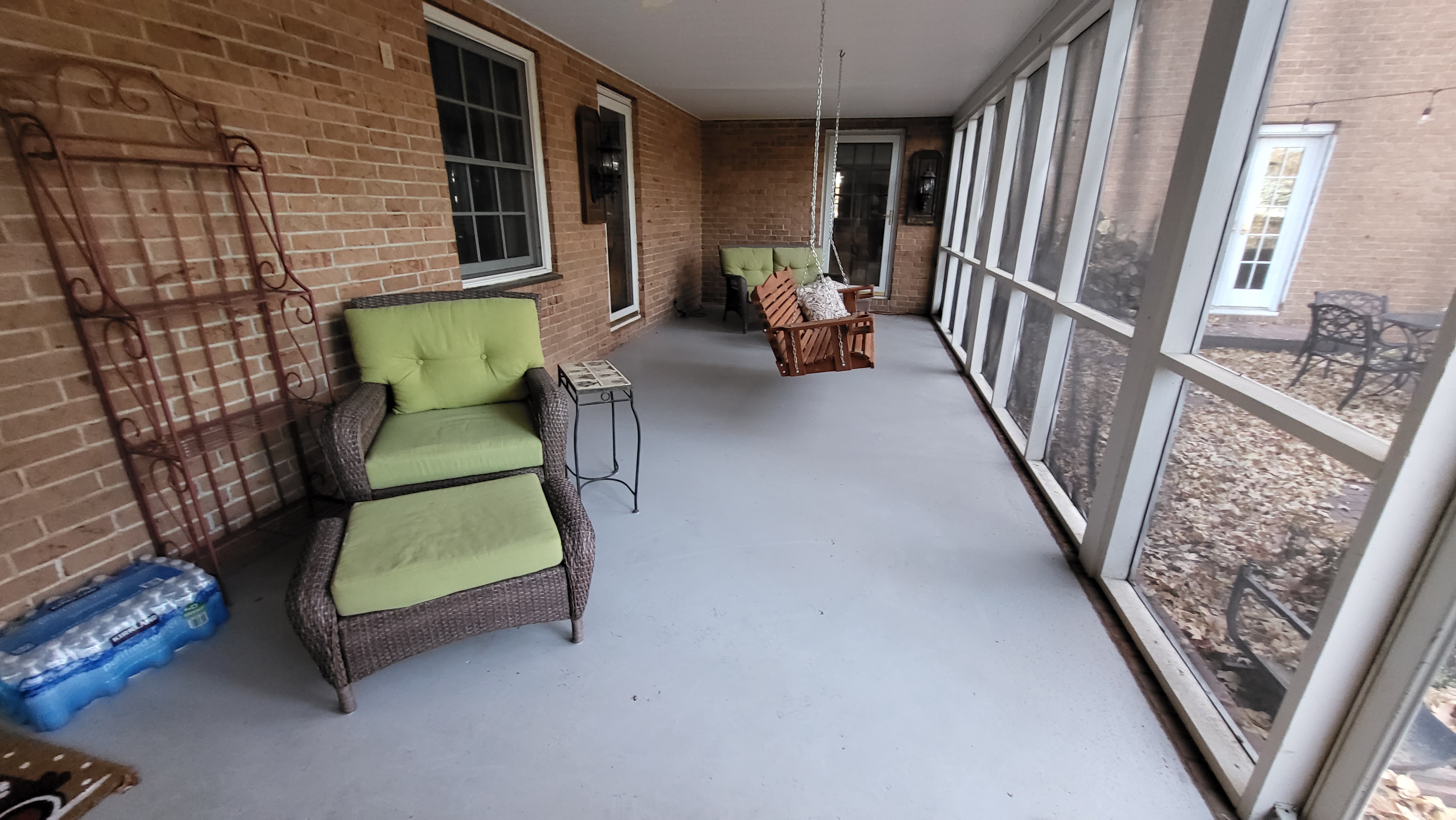Comfortable swing on porch.